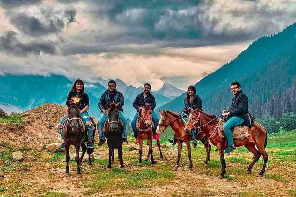 Horse riding in Jammu and Kashmir through scenic meadows, mountain trails and beautiful Himalayan landscapes.