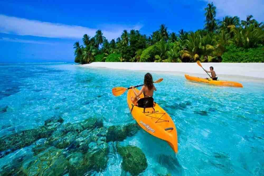 Lakshadweep tour packages featuring pristine beaches, turquoise lagoons, coral reefs and tropical island landscapes.