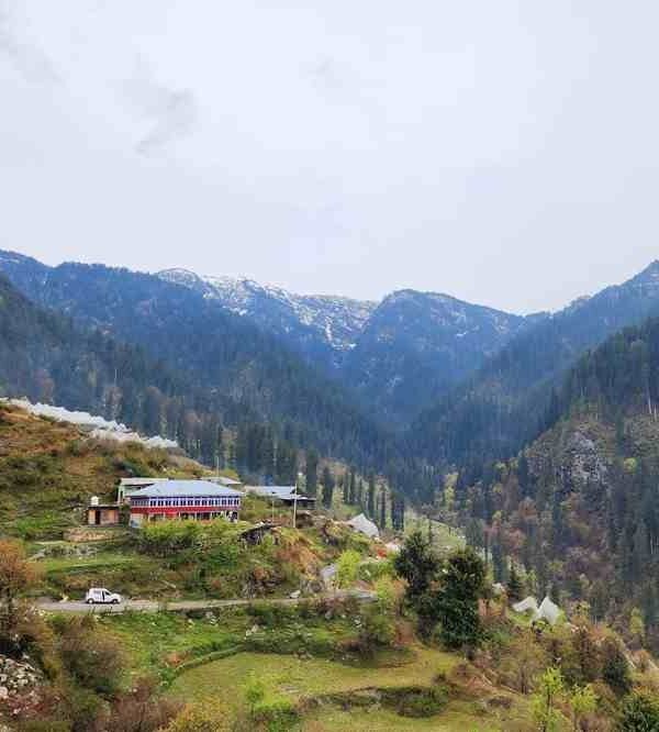 Shoja Village, Himachal Pradesh, is surrounded by lush forests, Himalayan mountains and peaceful scenic landscapes.