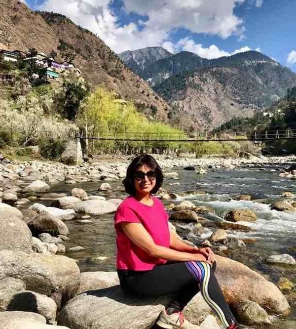 Tirthan Valley, Himachal Pradesh, is surrounded by Himalayan mountains, lush forests and a scenic river.