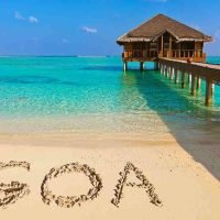 Goa tourism featuring beautiful beaches, palm trees, Portuguese heritage, water sports and vibrant coastal landscapes.